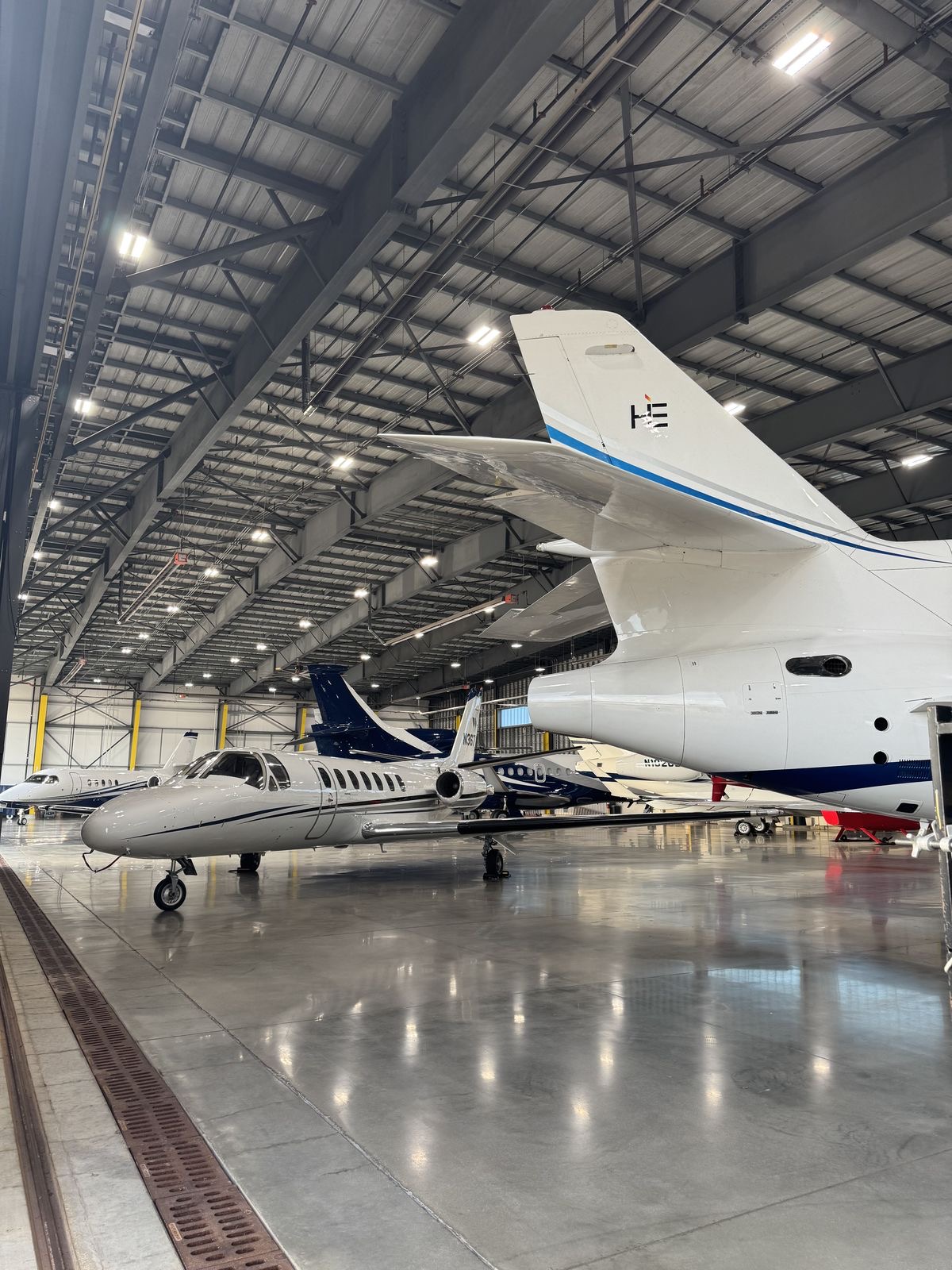 Private jets inside a hangar
