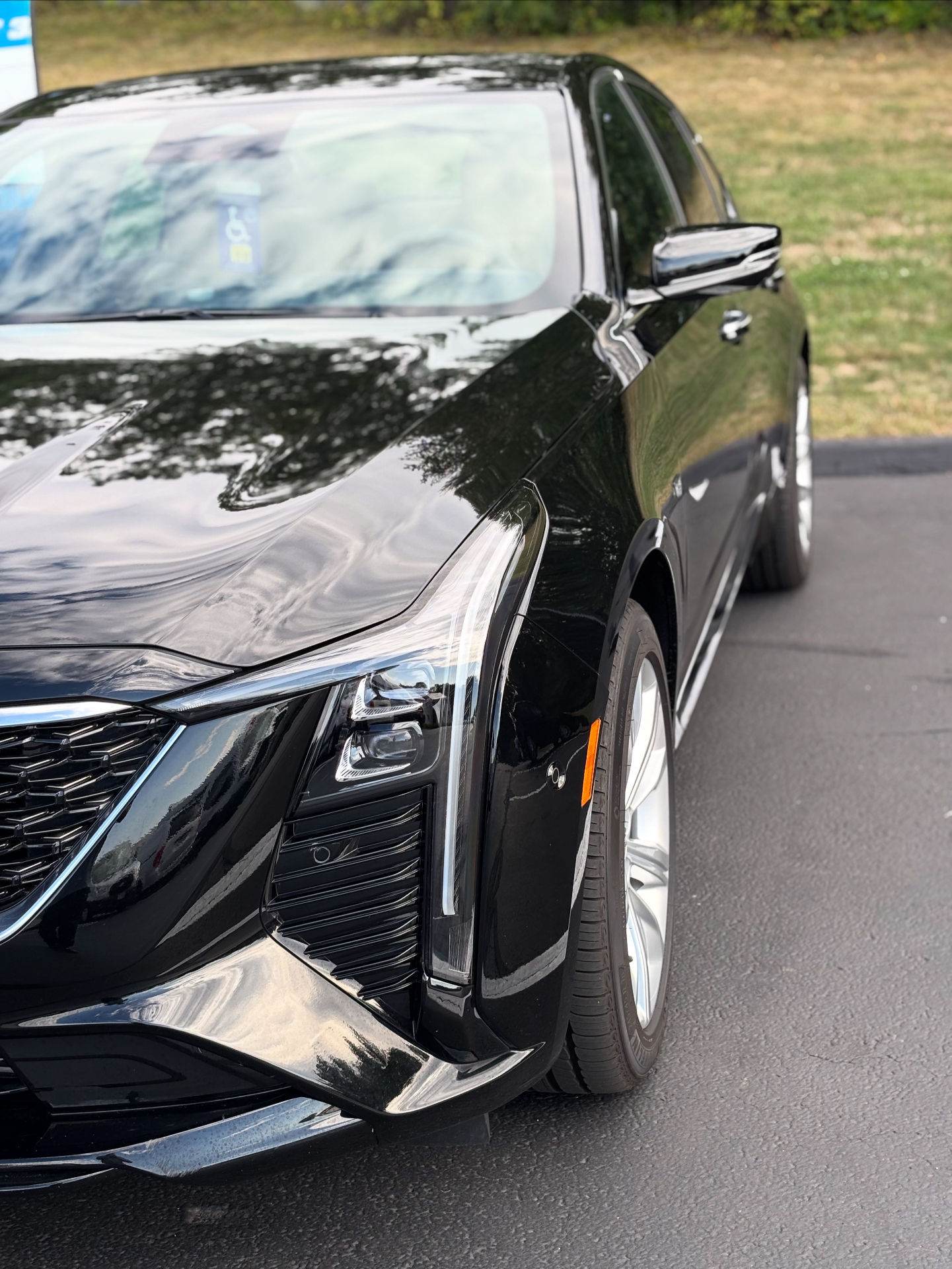 Glossy black Cadillac after detail